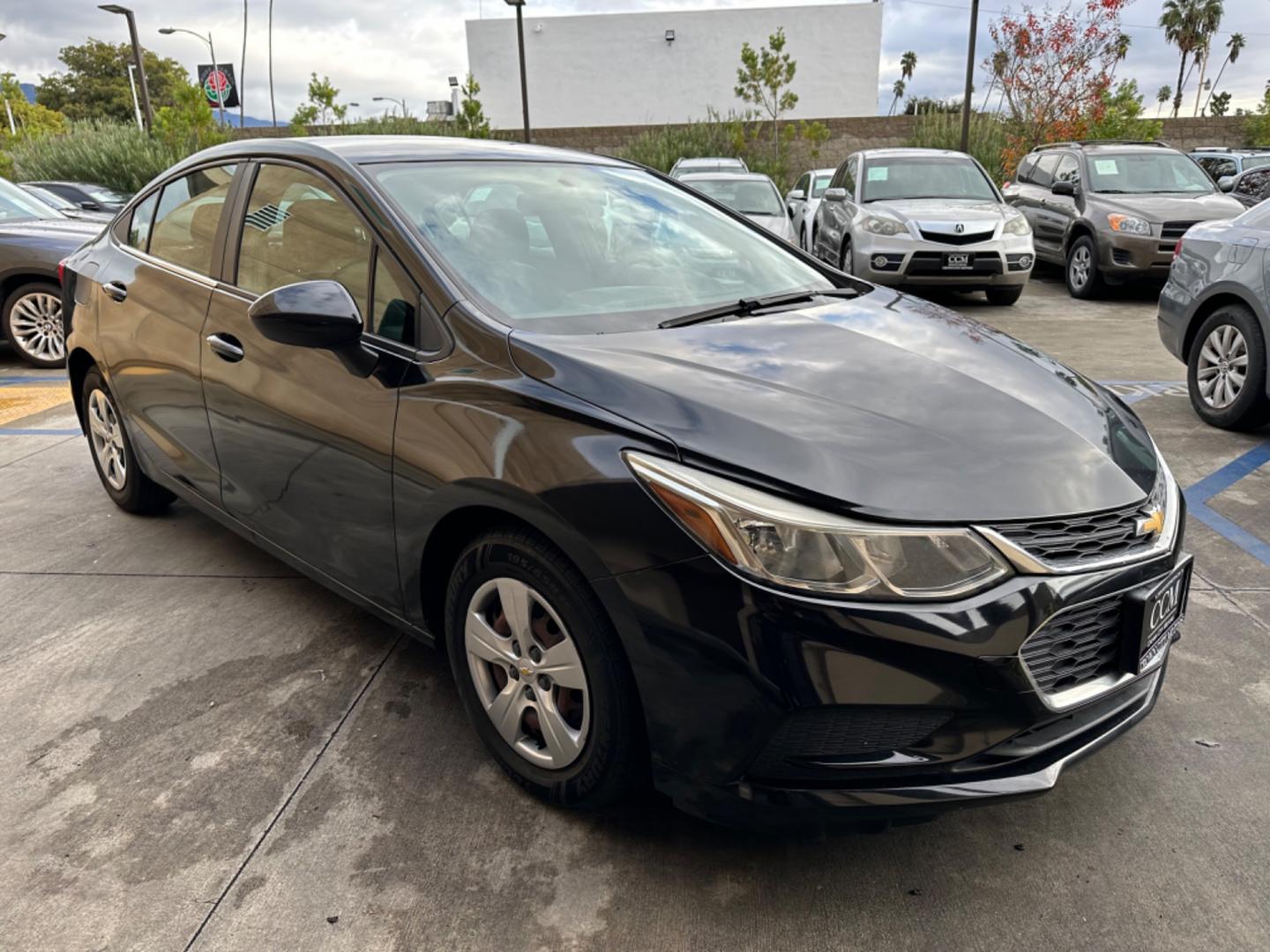 2017 Black /BLACK Chevrolet Cruze LS Auto (1G1BC5SM6H7) with an 1.4L L4 DOHC 16V TURBO engine, 6A transmission, located at 30 S. Berkeley Avenue, Pasadena, CA, 91107, (626) 248-7567, 34.145447, -118.109398 - Crown City Motors is a used “Buy Here Pay Here” car dealer in Pasadena CA. “Buy Here Pay Here” financing, means that when you purchase your vehicle from our dealership, that you make the payments to the dealership as well. We do not need the banks approval to get you approved for a used auto - Photo#6